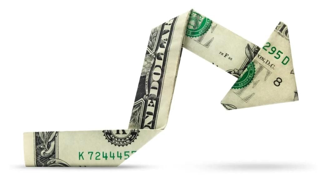 Dollar bill folded into an arrow